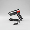 Black and red hair dryer with a car charger cable on a white background